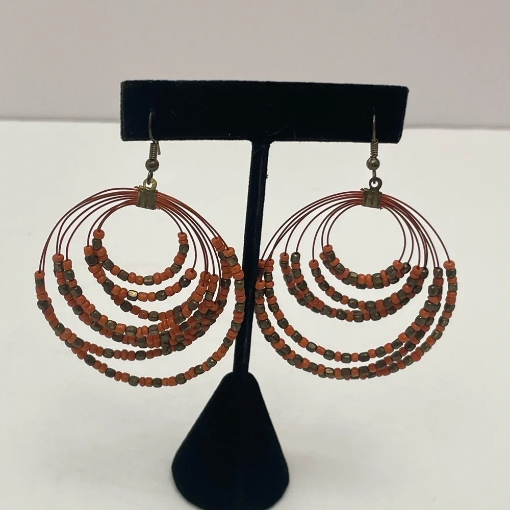 Coral and copper bead multi strand round drop earrings.